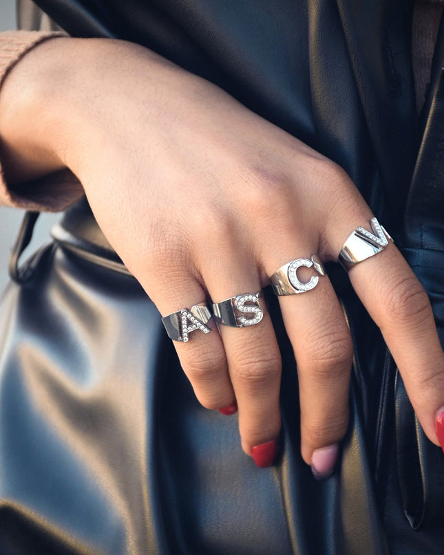 Delicate ring with initial and cubic zirconia.
