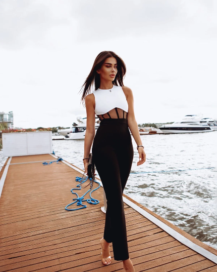 Two-tone black and white jumpsuit with sheer details.