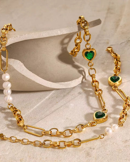 Stainless steel necklace with green hearts.