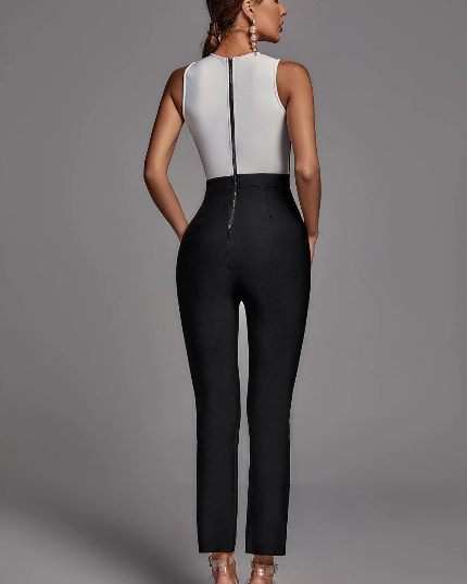 Two-tone black and white jumpsuit with sheer details.