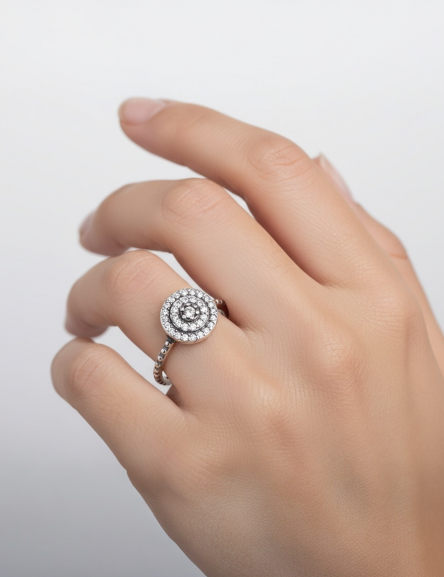 Luxury ring with circle and cubic zirconia.